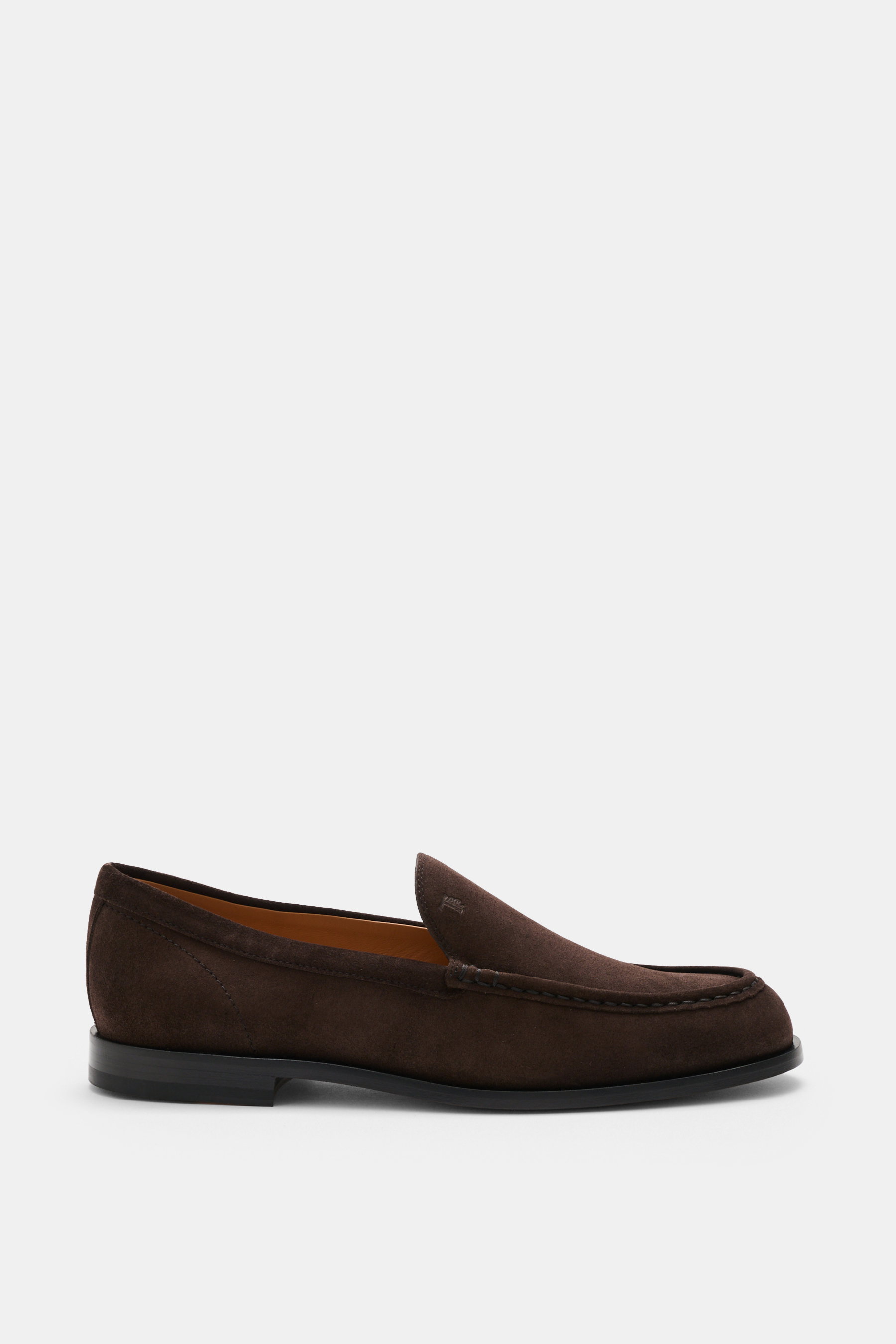Side view of Tod's Loafer dark brown in supple suede leather with a slightly tapered silhouette, topstitching on the front cap, leather outsole, and stitched construction.