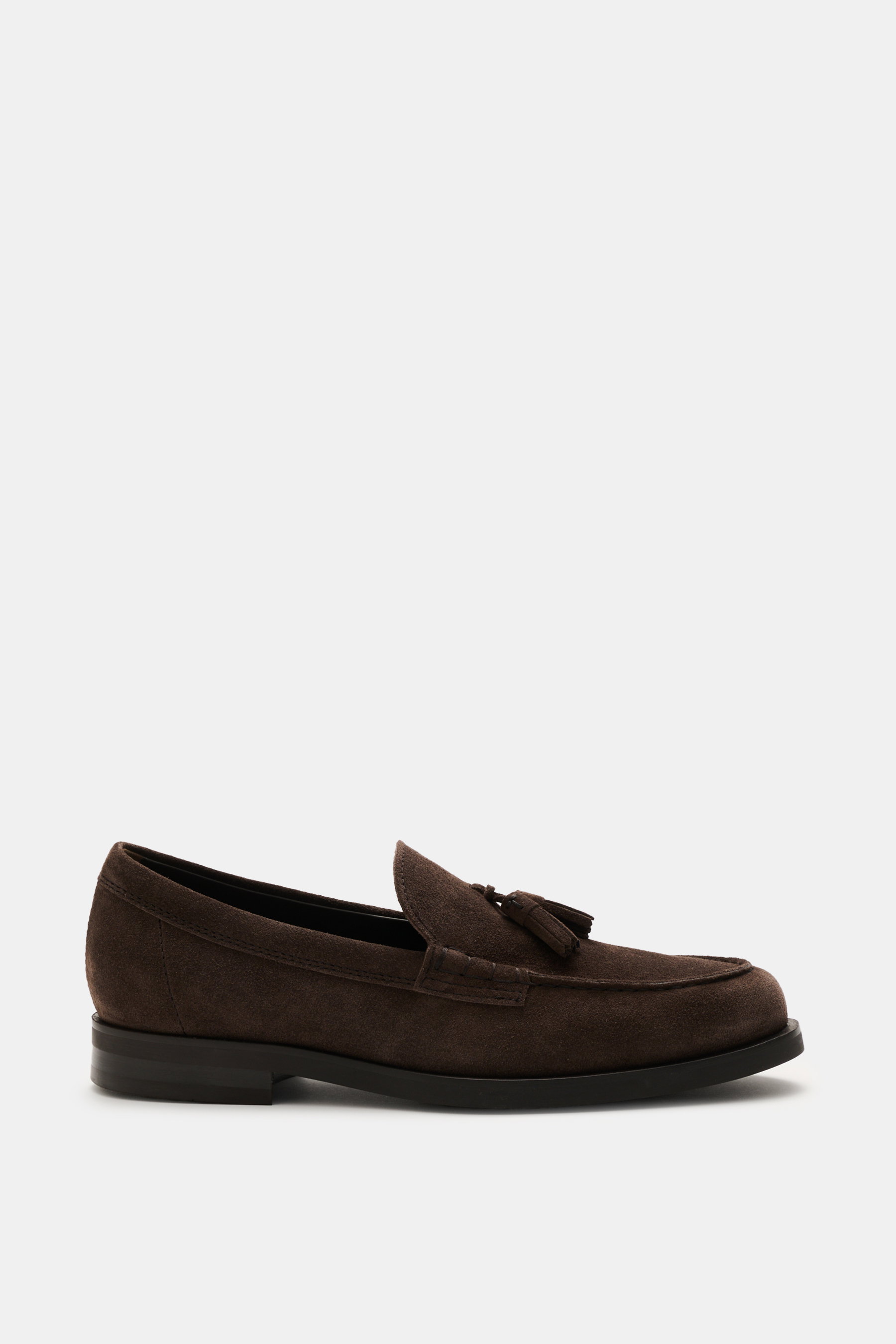 Side view of Tod's Tassel Loafer grey brown in soft suede leather with leather tassel, slightly narrow tapered silhouette, topstitch on toe cap, and robust rubber sole with tread.