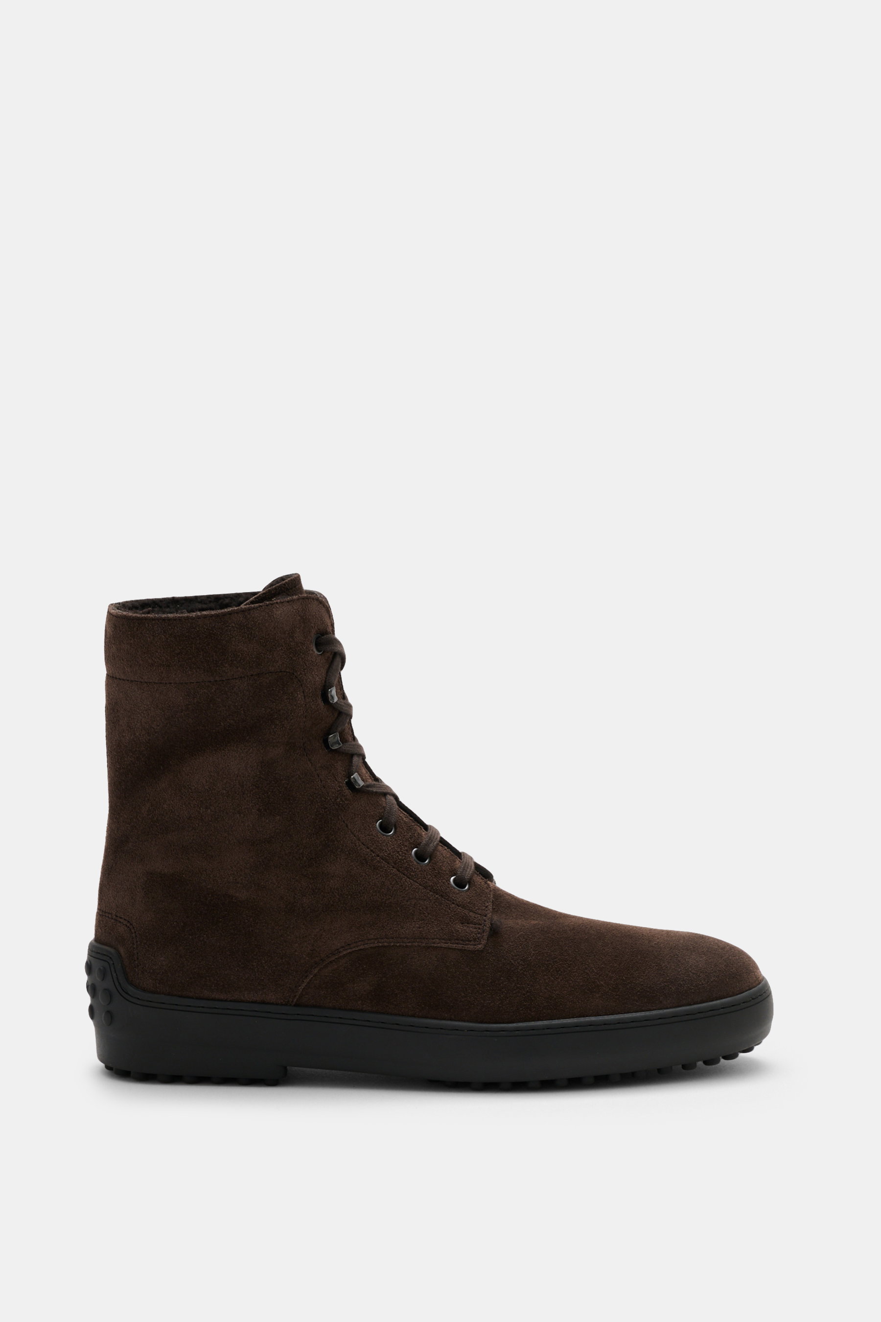 Side view of Tod's Lace-up boots brown in soft suede with a slightly tapered cut, seven-eyelet lacing with hooks and eyelets, lambskin lining, and signature nubbed rubber sole.
