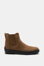 Side view of Tod's Chelsea Boot light brown in soft suede leather, slightly narrow tapered with side elastic inserts, leather lining, practical pull tab, and typical studded rubber sole.
