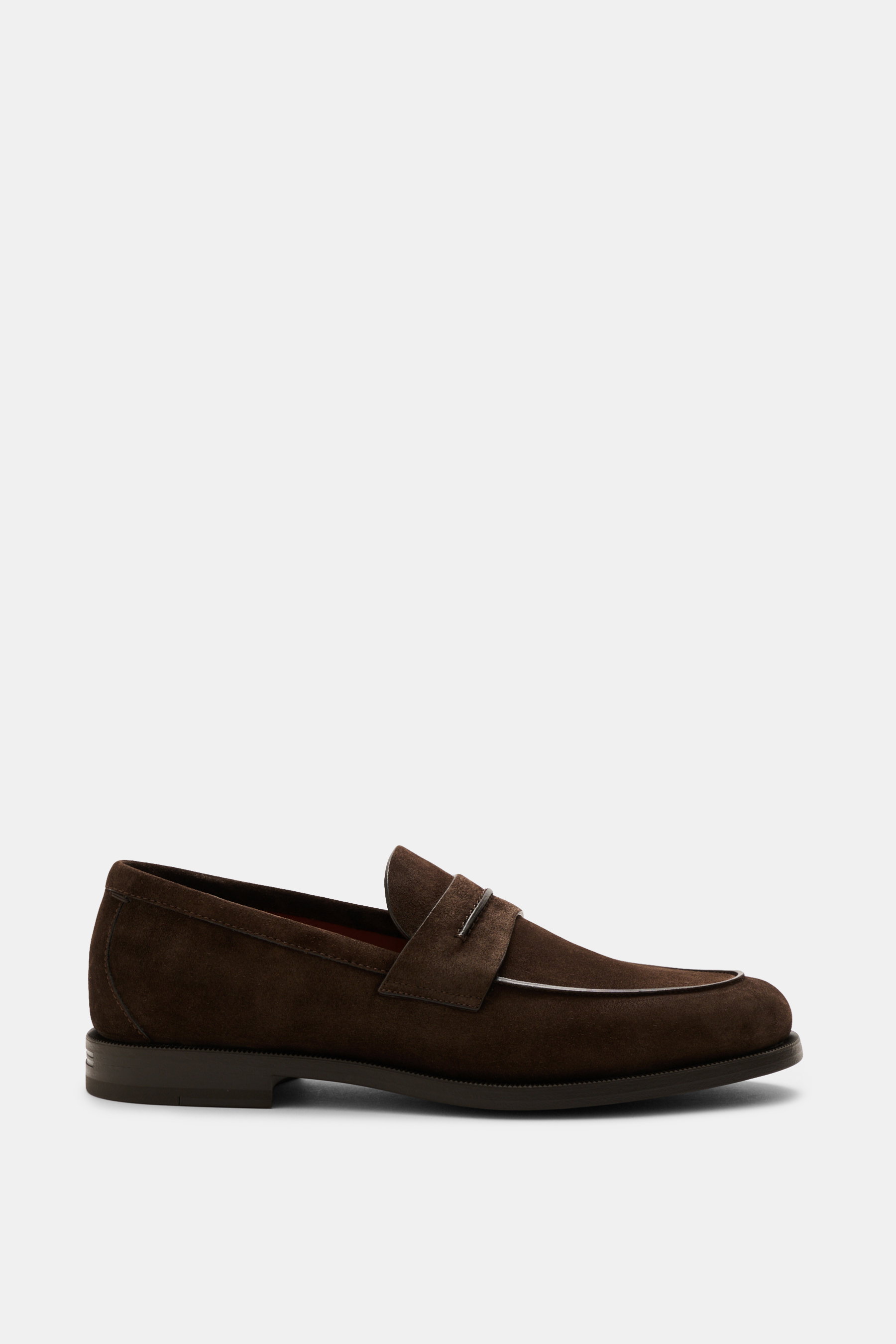 Side view of Zegna Penny Loafer dark brown in soft suede with penny strap, narrow tapering silhouette, Blake stitch, rubber sole.

Description: <p>Made from luxuriously soft suede, ZEGNA's Penny Loafer combines timeless elegance with contemporary function