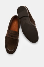 Top-down view of Zegna Penny Loafer dark brown in noble suede leather with penny strap, narrow tapering silhouette, Blake construction, decorative toe stitch, leather lining, and rubber outsole.