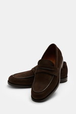 Front-side view of Zegna Penny Loafer dark brown in soft suede with narrow silhouette, penny strap, Blake stitch, leather lining, rubber sole.