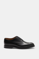 Church's Oxford shoes 'Consul' black shown from the side, polished calf leather, Goodyear welted, narrow toe cap, closed five-eyelet lacing, leather lining, leather outsole, rubber-reinforced heel.