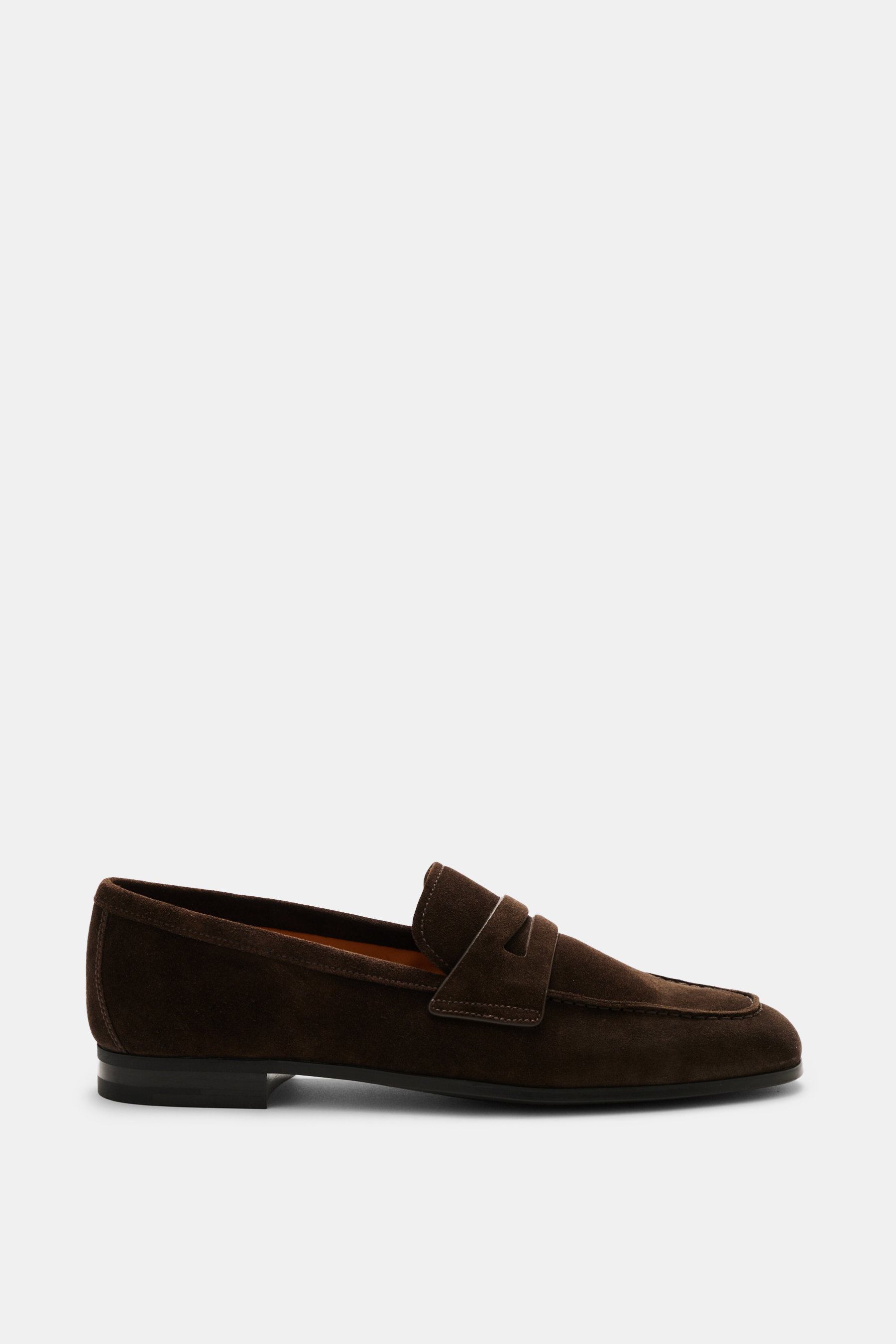 Church's Penny Loafer 'Milton' dark brown in supple suede leather, narrow tapered silhouette, penny strap, decorative toe stitching, leather lining, rubber outsole, rubber heel, side view. 

<p>The Penny Loafer 'Milton' by CHURCH'S impresses with its supp