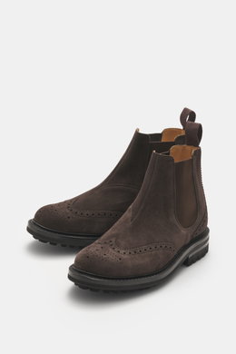 Front-side view of Church's Chelsea Boot 'MC Entyre LW' grey-brown in fine suede leather with broguing, rounded silhouette, elastic inserts, leather lining, practical pull loop, and profiled rubber outsole, showcasing exquisite craftsmanship perfect for a