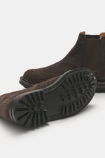 Side and sole view of Church's Chelsea Boot 'MC Entyre LW' grey-brown in fine suede leather with broguing, rounded silhouette, elastic inserts, leather lining, practical pull loop, and profiled rubber outsole, showcasing exquisite craftsmanship perfect fo