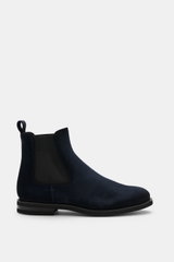 Side view of Fabiano Ricci Chelsea Boot navy in noble suede leather with elastic inserts, tapered silhouette, leather lining, pull tab, and flexible rubber sole.