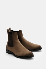 Side view of Fabiano Ricci Chelsea Boot grey-brown in noble suede leather with elastic inserts, tapered silhouette, pull tab, and flexible rubber sole, photographed from a slightly elevated front angle.

Description: <p>This sporty Chelsea boot made of no