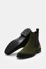 Fabiano Ricci Chelsea Boot dark green shown from a low side and sole perspective, featuring noble suede leather, slightly tapered silhouette, elastic inserts, leather lining, practical pull tab, and flexible studded rubber sole for comfort.

Description: 