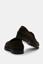 Close-up side and bottom view of Fabiano Ricci Penny Loafer 'Tennessee' dark brown in noble suede leather with narrow tapering silhouette and flexible FIBRAM sole.

Description: <p>Purist, lightweight, and with noticeable luxury: This Penny Loafer by FABI