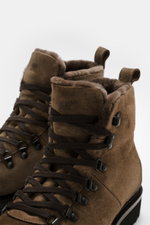 Close-up front-side view of Fabiano Ricci Lace-up boot taupe in noble suede leather with rounded toe cap, seven-eyelet lacing, leather lining, and flexible rubber sole, essential for colder days.

Description: <p>Essential for colder days: The suede lace-