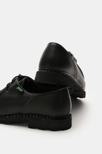 Paraboot Lace-up shoes 'Michael' black shown from rear side angle, grained smooth leather, Norwegian welt seam, moc-toe, two-eyelet lacing, leather lining, natural rubber sole.