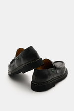 Paraboot Penny loafers 'Reims' black shown from a low rear angle highlighting the chunky sole and vintage calf leather finish.

<p>With its special vintage finish and chunky silhouette, the Penny Loafer 'Reims' from PARABOOT becomes a statement piece.<ul>
