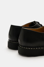 Paraboot Dress shoes 'Michael' black shown from the rear angle, featuring fine nubuck leather, Norwegian welted design, tapered cut, two-eyelet lacing, subtle PARABOOT label, leather lining, and robust natural rubber sole, a timeless classic designed in 1