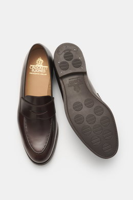 Crockett & Jones Penny Loafer 'Henley' dark brown polished smooth leather shoe shown from top and sole view with stitched sole, penny strap, and rubber outsole.