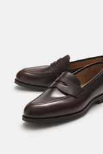 Side and front view of Crockett & Jones Penny Loafer 'Henley' dark brown in polished smooth leather with stitched sole and rubber outsole.

Description: 
<p>Elegant model in polished smooth leather by CROCKETT & JONES: With its noble finish and non-slip r