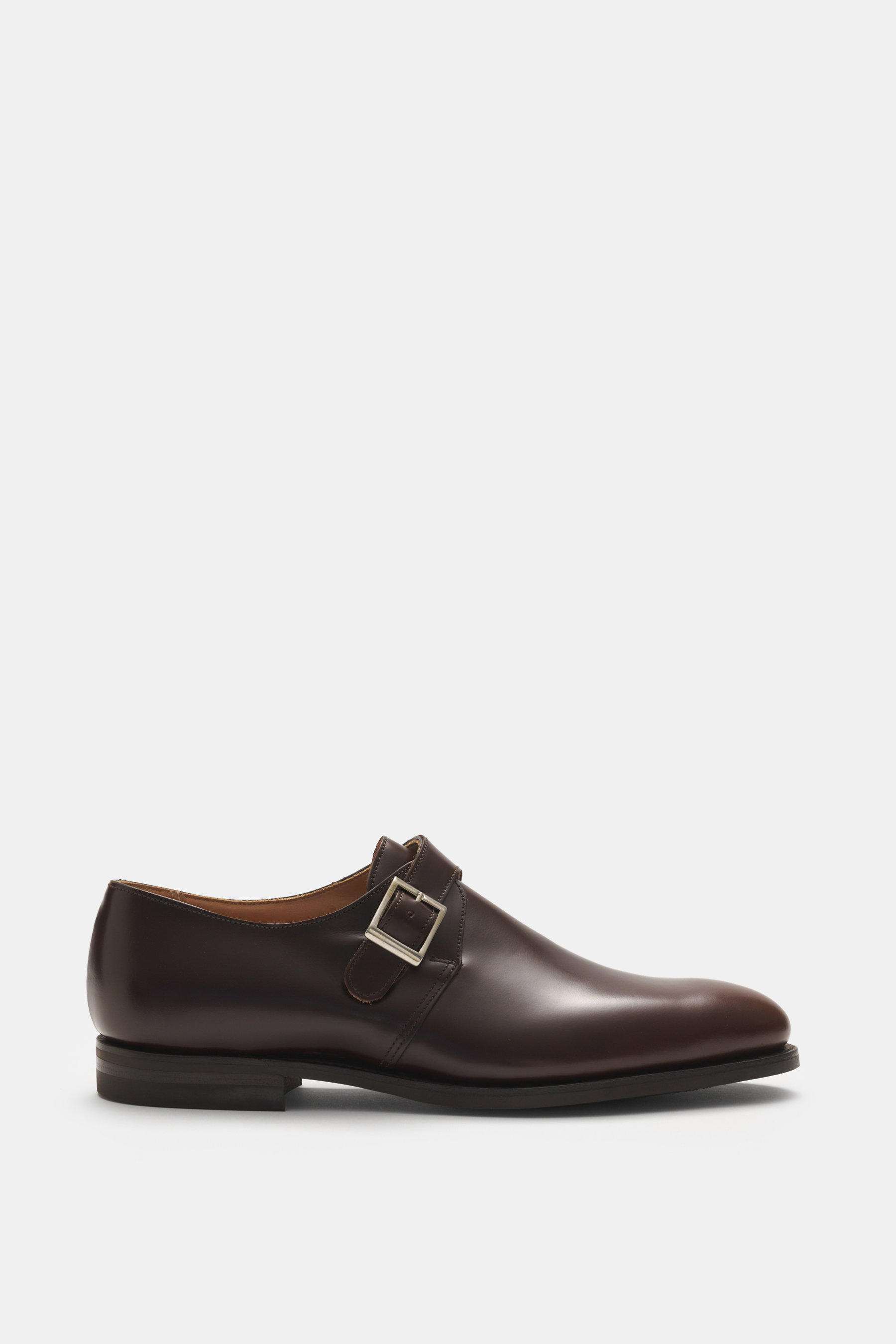 Crockett & Jones Monk 'Monkton' dunkelbraun aus poliertem Glattleder, Seitenansicht, schmale Silhouette, Schließe, rutschsichere Kautschuksohle.