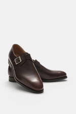 Front-side view of Crockett & Jones Monk 'Monkton' dark brown shoe in polished smooth leather with buckle, stitched sole, tapering silhouette, and rubber outsole.