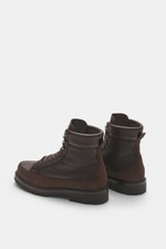 Side and rear view of Brunello Cucinelli Dark Brown Lace-Up Boot made from grained and suede leather with high ten-eyelet lacing and rubber sole.

Description:
<p>Robust lace-up boot by BRUNELLO CUCINELLI: This luxurious casual model is made from grained 