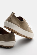 Rear and side view of Officine Creative Sneaker 'Vulcan' taupe in velour leather with round toe, seven-hole lacing, logo tab, leather lining, and studded rubber sole.