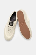 Stone Island Sneaker cream/sand shown from above and bottom, featuring canvas and suede leather, round toe cap, surrounding rubber coating, five-hole lacing, logo patch on the tongue, textile lining, and durable rubber sole.