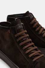 Santoni High Top Sneaker 'Dump' dark brown shown from a close-up angled front view, featuring supple suede leather, textile lining, round toe cap, eight-eyelet lacing, side zipper, emblem on the tongue, contrasting stitching details, and a comfortable rub