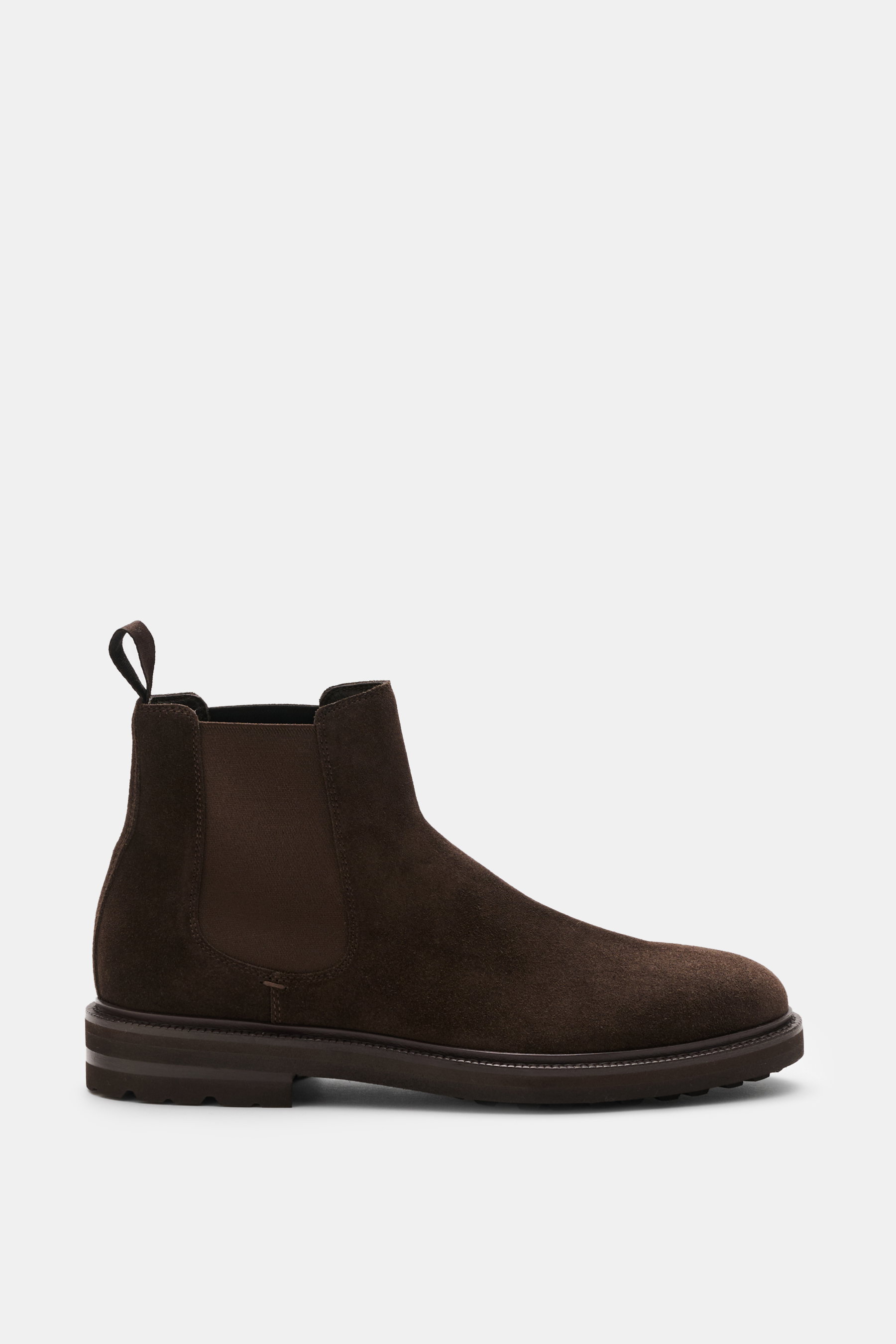 Henderson Chelsea boots dark brown in premium suede shown from the side, featuring elasticated inserts, pull-on tab, Blake design, leather lining, and Vibram outsole. A symbol of confident British style perfected by Italian design.