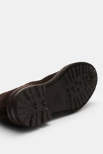 Close-up view of the sole of Henderson Chelsea boots dark brown made of premium suede, showing the treaded Vibram outsole and pull-on loop.

Description: 
A symbol of confident British style, perfected by Italian design: These classic Chelsea boots in fin