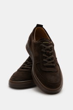 Front angled view of Henderson Sneaker 'Levante' dark brown made of soft suede leather, round toe cap, five-eyelet lacing, logo embossing on tongue, perforated leather lining, and rubber outsole.