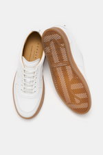 Top view of Henderson Sneaker 'Vitello' white showing noble smooth leather, rounded toe cap, six-eyelet lacing, logo embossing on tongue, leather lining, and light rubber outsole.