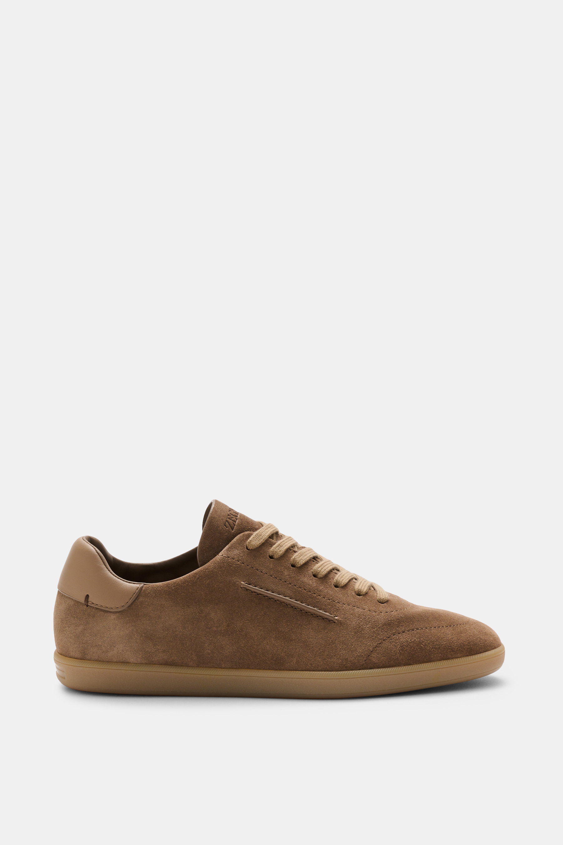 Side view of Zegna Sneakers taupe in smooth suede, featuring a round toe cap, seven-eyelet lacing, embossed tongue, leather lining, and flexible natural rubber sole.