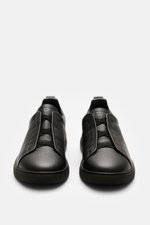 Zegna Slip-on Sneaker 'Triple Stitch' black shown from front top view, grained leather, round toe, crossed elastic bands, padded collar, pull tab, embossed tongue, leather lining, rubber sole.