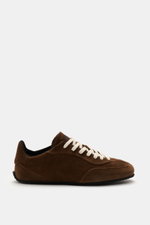Side view of Axel Arigato Sneaker 'Daze Runner' dark brown in supple suede leather with tonal overlays, rounded toe cap, seven-eyelet lacing, padded collar, terry lining, and flexible rubber sole, handmade in Portugal.