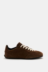Side view of Axel Arigato Sneaker 'Daze Runner' dark brown in supple suede leather with tonal overlays, rounded toe cap, seven-eyelet lacing, padded collar, terry lining, and flexible rubber sole, handmade in Portugal.
