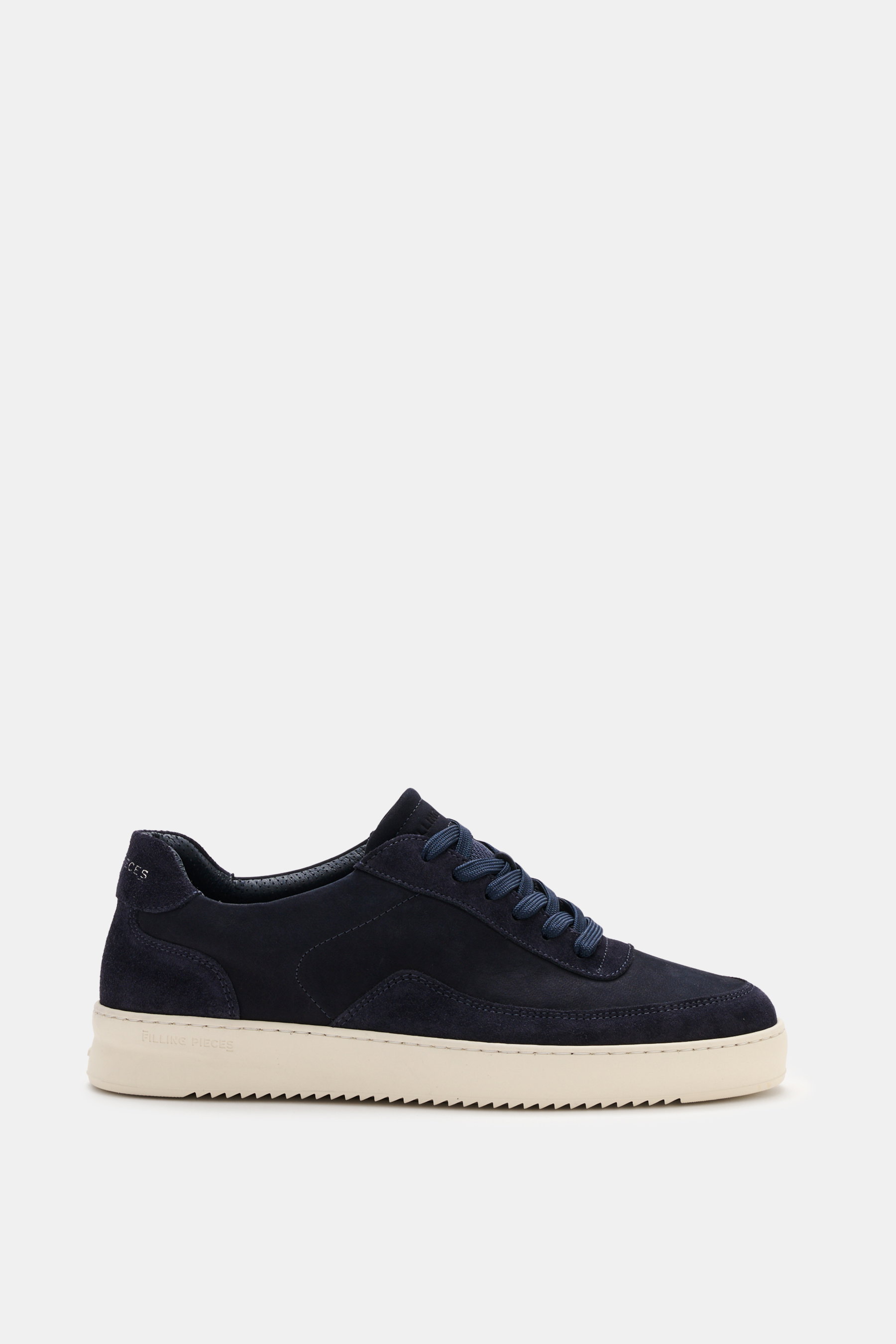 Filling Pieces Sneaker 'Mondo Suede' navy shown from side on white background, made of high-quality suede leather with six-eyelet lacing, rounded toe cap, padded collar with logo print, tongue with embossed label, perforated leather lining, and ribbed rub