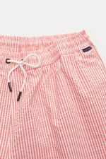 Close-up front view of 04651/ A trip in a bag Seersucker swim shorts 'Seersucker Swim' orange/white striped with elastic waistband and drawstring.

You'll be perfectly prepared for a dip in the sea or the pool in the 'Seersucker Swim' swim shorts by 04651