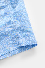 Close-up side view of 04651/ A trip in a bag Badeshorts 'Seamap' blau/weiß gemustert with quick-drying microfiber and small hem slit.