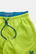 Vilebrequin Swim shorts 'Moka' neon green/teal shown from front close-up, featuring elastic waistband, blue drawstring, turtle stitching.