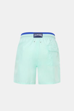 Vilebrequin Swim shorts 'Moka' mint green/dark blue shown from the back, featuring elastic waistband, side and back pockets, drainage eyelets, turtle stitching, VILEBREQUIN label, mesh lining, and high-quality microfibre for comfort.