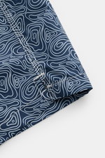 Close-up side view of 04651/ A trip in a bag Swim shorts 'Seamap' navy/white patterned with quick-drying microfibre, nautical chart print, hem vents, and detailed stitching.