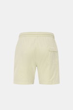 Rear view of 04651/ A trip in a bag Swim shorts 'Mono Seersucker' sage in seersucker microfibre, elastic waistband, side and back pockets, and mesh lining. Perfect for your next summer holiday: With their design in seersucker look, these swim shorts by 04