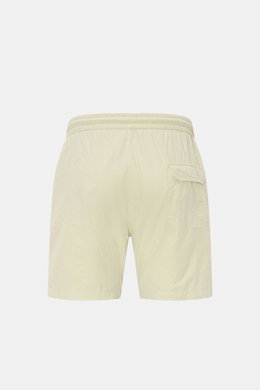 Rear view of 04651/ A trip in a bag Swim shorts 'Mono Seersucker' sage in seersucker microfibre, elastic waistband, side and back pockets, and mesh lining. Perfect for your next summer holiday: With their design in seersucker look, these swim shorts by 04