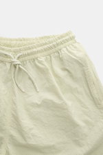 Top close-up view of 04651/ A trip in a bag Swim shorts 'Mono Seersucker' sage with elasticated waistband, drawstring, and seersucker texture.

Description: <p>Perfect for your next summer holiday: With their design in seersucker look, these swim shorts b