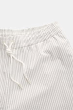 Close-up top view of 04651/ A trip in a bag Swim shorts light grey/white striped with elastic waistband and drawstring.

<p>Perfect for your next summer holiday: With their modern striped pattern, these swim shorts by 04651/ A TRIP IN A BAG are an eye-cat