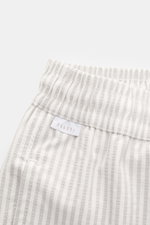 Close-up front view of 04651/ A trip in a bag Swim shorts light grey/white striped with elastic waistband and label.

<p>Perfect for your next summer holiday: With their modern striped pattern, these swim shorts by 04651/ A TRIP IN A BAG are an eye-catchi