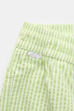 Close-up top view of 04651/ A trip in a bag Swim shorts pastel green/white striped showing elastic waistband and side pocket.

<p>Perfect for your next summer holiday: With their modern striped pattern, these swim shorts by 04651/ A TRIP IN A BAG are an e