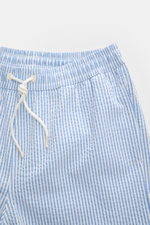 Front close-up view of 04651/ A trip in a bag Swim shorts blue/white striped with elasticated waistband and drawstring.

<p>Perfect for your next summer holiday: With their modern striped pattern, these swim shorts by 04651/ A TRIP IN A BAG are an eye-cat