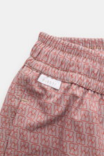 04651/ A trip in a bag Badeshorts 'Hansen' taupe/rot gemustert, Nahaufnahme seitlich mit elastischem Bund, Tunnelzug und Taschen.