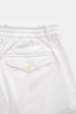 Close-up rear view of 04651/ A trip in a bag Badeshorts 'Plain Swim' off-white showing elastic waistband, back pocket with button, made of soft, quick-drying microfiber.